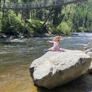 The Merc manager John's daughter Emmy casting off a rock at Welcome Bridge